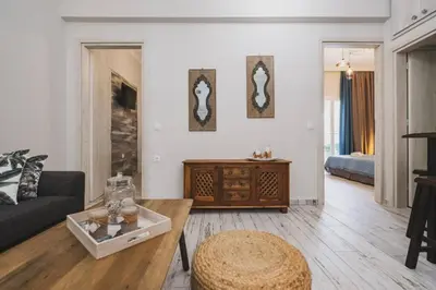 a living room with a couch and a table at D&G Lux City Flat next to Old Town and Market in Chania Town