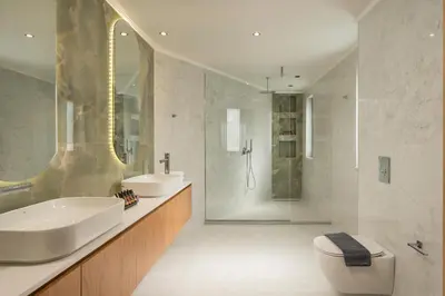 a bathroom with a sink and a toilet and a shower at Villa City View - Heated Pool & Gym - Majestic views - 5 min drive from center in Chania Town