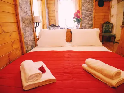 a bedroom with a bed with towels on it at Casa di Portou No3 in Chania Town