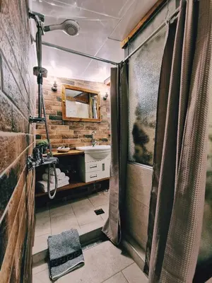 a bathroom with a shower and a sink at Casa di Portou No3 in Chania Town