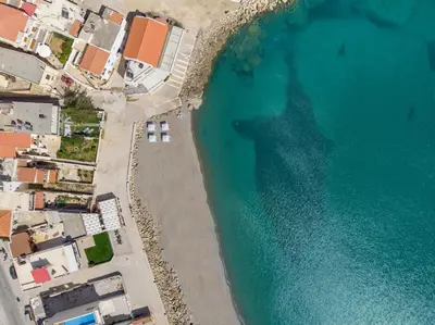 an overhead view of a beach and the ocean at Kolymbari Sea Front Cozy Apartments in Kolymvari