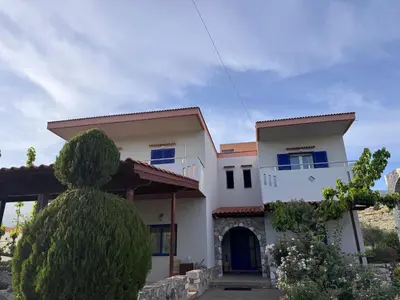 a house with a tree in front of it at Xenonas Anopolis 2 in Anopoli Sfakion