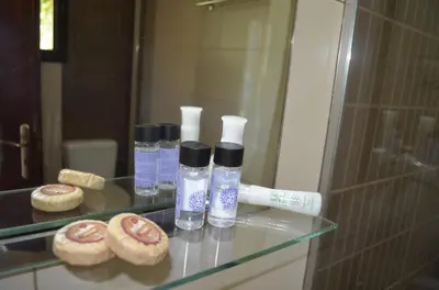 a glass table with bottles of water and a toothbrush at Xenonas Anopolis 2 in Anopoli Sfakion