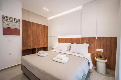 a bedroom with a bed with two towels on it at Margiani Studio & Apartment in Chania Town