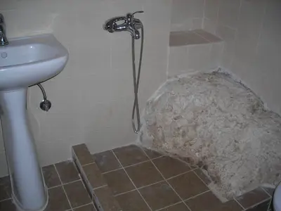 a bathroom with a shower and a sink and a shower at Patriko Traditional Stone Houses in Vafés
