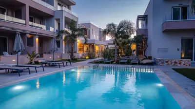 a swimming pool in the middle of a building at Relax Hotel in Palaiochóra