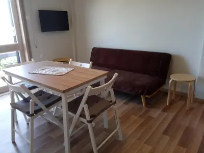a living room with a table and a couch at Villa Anastasia in Kalamaki Chanion
