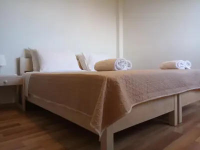 a bed with two pillows on it in a bedroom at Villa Anastasia in Kalamaki Chanion