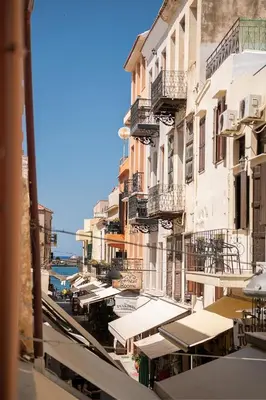a view of a street with buildings and tables at Chrisselen Palazzo Colombo in Chania Town