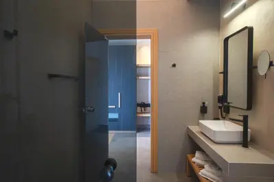 a bathroom with a shower with a sink and a mirror at panorama new generation in Sfakiá