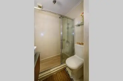 a bathroom with a toilet and a shower at Family home w. yard in Beating Heart of Old Town in Chania Town