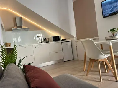 a living room with a couch and a table at Valentina's Luxury House in Chania Town