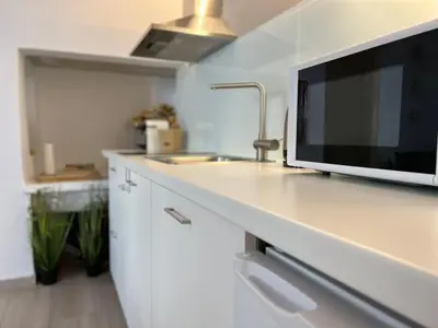a kitchen with a counter with a television on it at Valentina's Luxury House in Chania Town