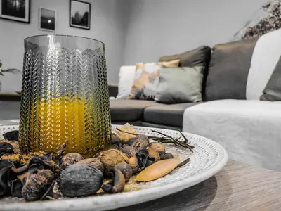 a plate of food on a table with a vase at Rocky Mountain Villa in Ramní
