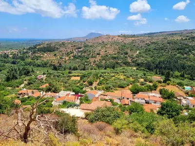 an aerial view of a small village on a hill at Villa Erontas -Private heated jacuzzi and mini pool in Makhairoí