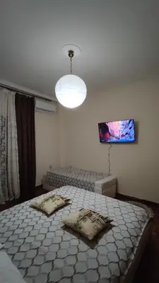 a bedroom with two beds and a light at Dominic Chania Center Apartment in Chania Town