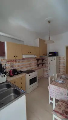 a kitchen with a sink and a stove top oven at Dominic Chania Center Apartment in Chania Town
