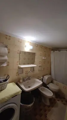a bathroom with a toilet and a sink at Dominic Chania Center Apartment in Chania Town
