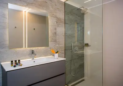 a bathroom with a sink and a shower at Villa Thallo in Galatás