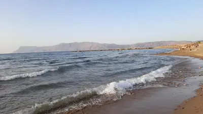 a beach with a group of people in the water at Kissamos Nice Apartment1 in Kissamos
