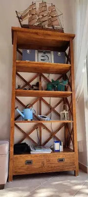 a wooden shelf with a clock on top of it at Kalyves Mili's house sea view in Plaka