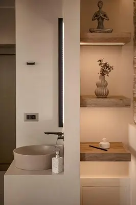 a bathroom with a sink and a bowl at Chrissida Hotel in Agia Marina Nea Kydonias
