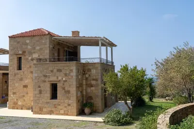 an external view of a stone house at Sunset Villas in Falasarna