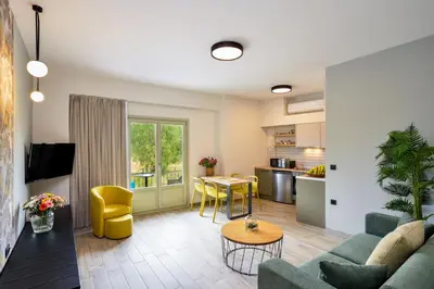 a living room with a couch and a table at Dandelion apartments in Chania Town