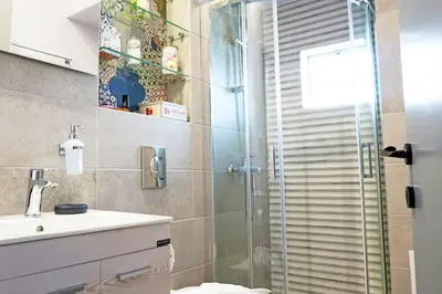 a bathroom with a shower and a sink at C-Home Studio in the heart of Chania in Chania Town