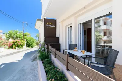 a balcony with a table on the side of a building at Marianthi's Maisonette in Chania Town