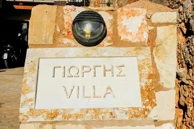 a sign that says happy villa with a light on it at Traditional Cretan Villa George - Private Pool in Kambánion