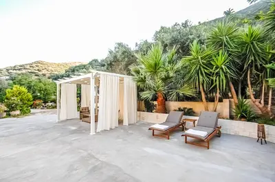 a patio with two chairs and a tent at Apartment close to Balos-Elafonisi and Falasarna! in Kámbos