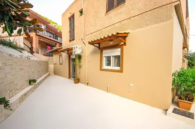 an empty alley with a building and a window at Apartment close to Balos-Elafonisi and Falasarna! in Kámbos