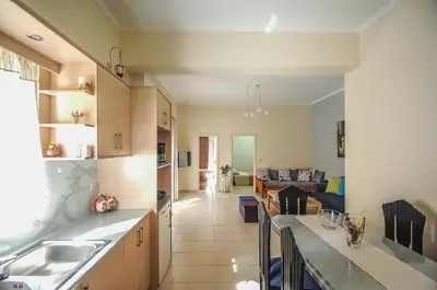 a kitchen and living room with a sink and a counter at Apartment close to Balos-Elafonisi and Falasarna! in Kámbos