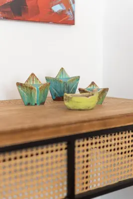 four bowls sitting on top of a wooden table at Villa Kiara 2 in Tersanas