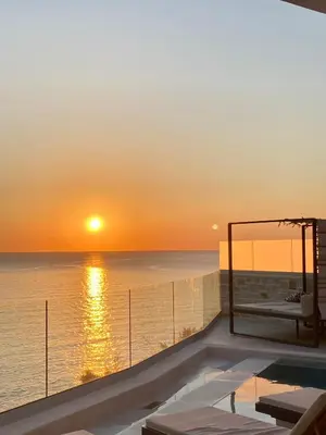 a view of a sunset from the deck of a cruise ship at Luxury Villa Dioskouroi Heated eco pool & jacuzzi in Kalyves