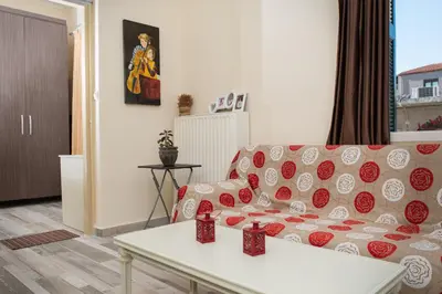 a living room with a couch and a table at Dominic Chania 2 Room Apartment in Chania Town