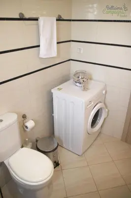 a bathroom with a toilet and a trash can at Bellisima Campagna Home pelekapina -chania crete in Chania Town