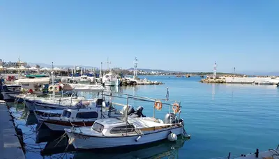 a group of boats are docked in a harbor at Filia Luxury Apartment in Chania Town