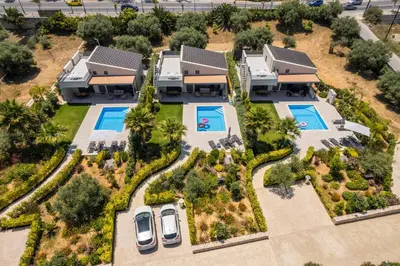 an aerial view of a villa with two swimming pools at Ethereal Villas Chania in Daratso