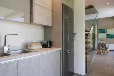 a kitchen with a sink and a counter at Ethereal Villas Chania in Daratso