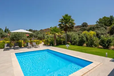 a swimming pool in the backyard of a villa at Ethereal Villas Chania in Daratso
