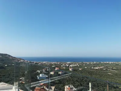 a view of the ocean from the top of a building at King Crimson Luxury Apartments in Marathokefála