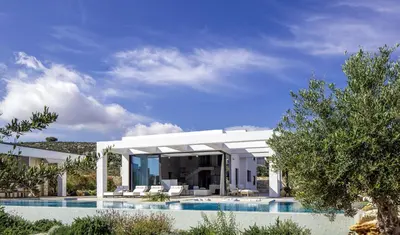 a villa with a swimming pool and a house at Chic Dream Villa in Agios Onoufrios