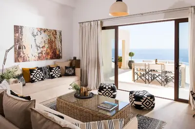 a living room with a view of the ocean at Villa Thetis Sfakia in Sfakiá