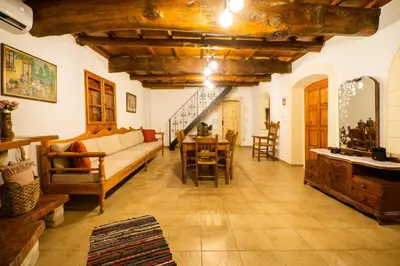 a living room with a couch and a table at Villa Tzitzifes in Tzitzifés