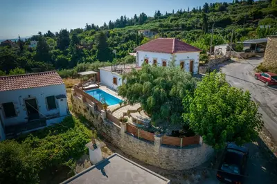 an aerial view of a house with a swimming pool at Villa Tzitzifes in Tzitzifés