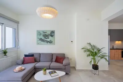 a living room with a couch and a table at Elia Residences in Chania Town
