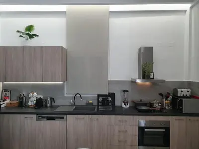a kitchen with a sink and a counter top at Isalos Seafront Villa I Sea fragrance in Chania Town