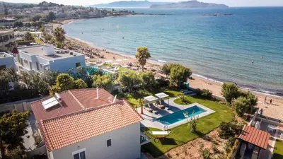 an aerial view of a beach and a house at Isalos Seafront Villa I Sea fragrance in Chania Town